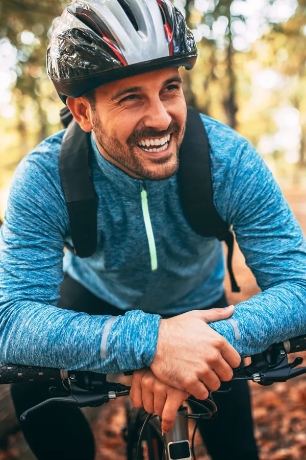 Adrenal-Hormone-Disorder-Treatment A smiling man getting ready for a cycling trip. Get treatment for adrenal hormone disorder from Stephen Beyer, DC in Mokena.