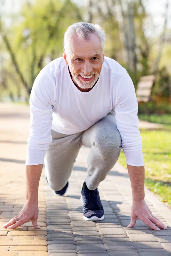 Degenerative-Disc-Disease-Treatment An older man sets in starting position for a run. Get treatment for degenerative disc disease from Stephen Beyer, DC in Mokena.