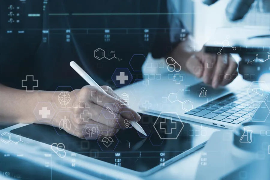 Health-Conditions-Treated-Doctor Close-up of a medical professional using a laptop and tablet, with illustrated medical symbols overlayed on the image, symbolizing health conditions treated by Stephen Beyer, DC in Mokena.