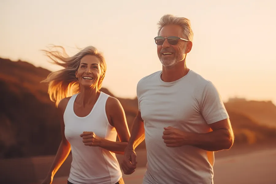 Wellness-Plans-Clinic A mature couple on a run at sunset. Get customized wellness plans from Stephen Beyer, DC in Mokena.